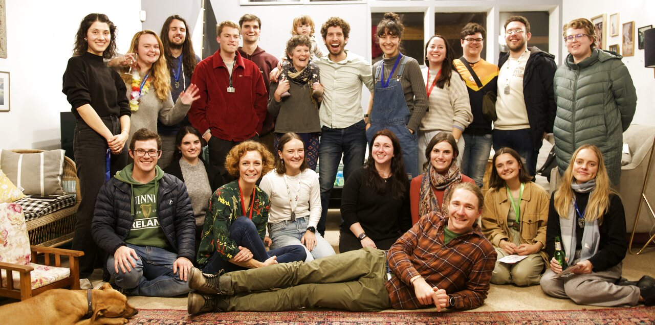 The whole RocketHour team together in one room, with the dog